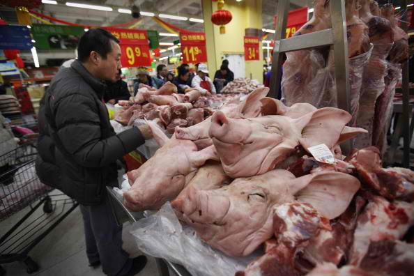 Chinese people buy pork in a Wal-Mart neighborhood market on Jan. 21, 2012 in Beijing, China. 