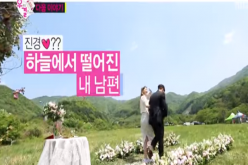 Jota and Kim Jin Kyung walk down the flower laden walkway as they 'got married.'
