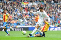 Real Madrid forward Cristiano Ronaldo against Valencia defenders.