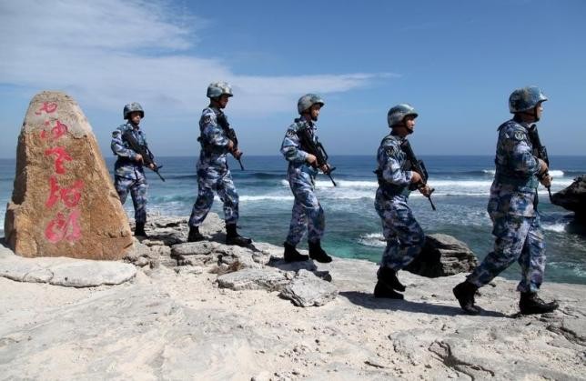 Members of the People's Liberation Army (PLA) patrol the Paracel Island, one of the disputed islands in the South China Sea.