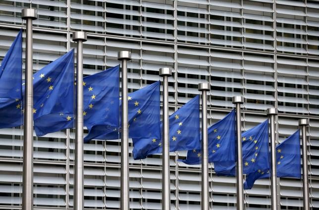 European Union flags flutter outside the EU Commission headquarters in Brussels, Belgium, in this file picture taken Oct. 28, 2015.