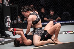 GIRL FIGHT | Mei Yamaguchi (top) rains down heavy strikes on Angela Lee in the main event of ONE: ASCENT TO POWER