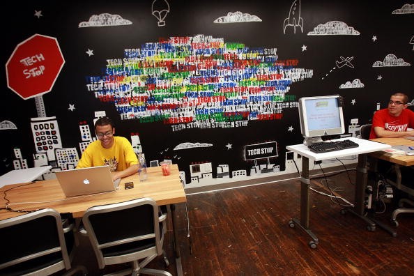 Employees of Google work at a 'tech stop' at the internet company's new office space