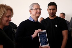 Apple CEO Tim Cook holds the new 9.7' iPad Pro during an Apple special event at the Apple headquarters on March 21, 2016 in Cupertino, California. 