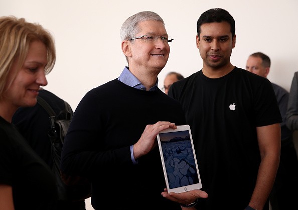 Apple CEO Tim Cook holds the new 9.7' iPad Pro during an Apple special event at the Apple headquarters on March 21, 2016 in Cupertino, California. 