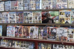 Pirated DVD copies of movies are displayed in a market at Xinjiang Uyghur Autonomous Region.