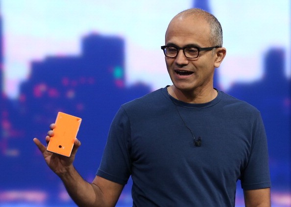 Microsoft CEO Satya Nadella holds a new Nokia Lumia 930 as he delivers a keynote address during the 2014 Microsoft Build developer conference on April 2, 2014 in San Francisco, California. 