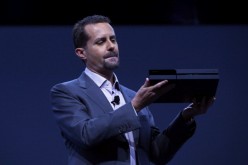 Andrew House, President and Group CEO Sony Computer Entertainment Inc., holds up a Playstation 4, not the PlayStation NEO 4K