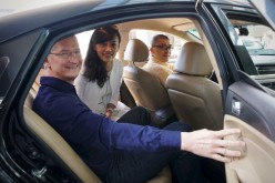 Tim Cook rides a cab with Didi Chuxing President Jean Liu.