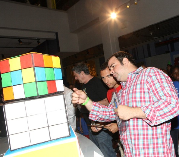 North American Champion Speed Cuber Anthony Brooks and TV personality George Duran attend the Cake-Off At Liberty Science Center In Honor Of Erno Rubik's Birthday on July 11, 2014 in Jersey City City.
