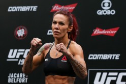 Cris 'Cyborg' Justino is posing in front of the crowd at the UFC 198 weigh-ins.