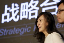 Jean Liu, Didi Chuxing president, answers questions from media during a news conference in Beijing early this year.  
