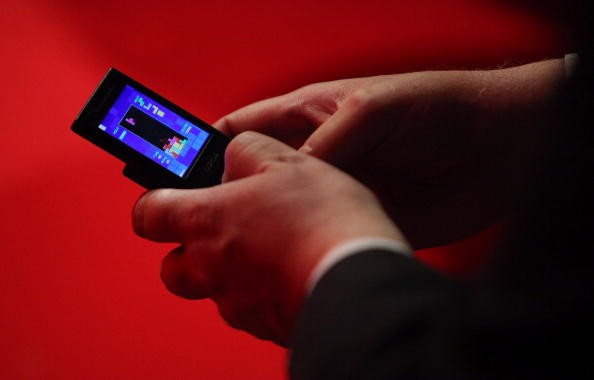 Man playing Tetris on the phone. Tetris movie will start filming next year.