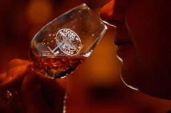 Andrew Kirk, a malt advocate, noses a glass of whisky