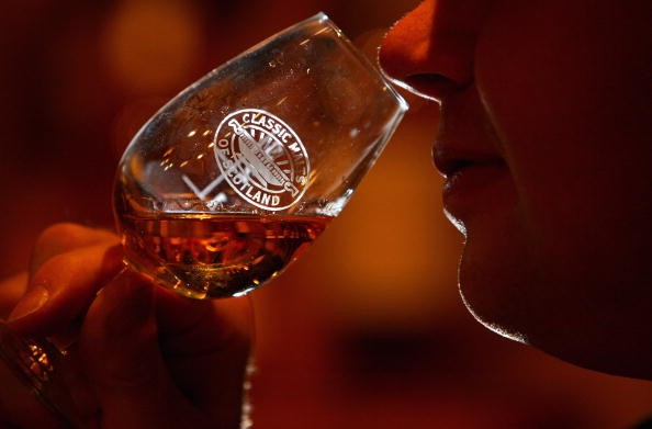 Andrew Kirk, a malt advocate, noses a glass of whisky