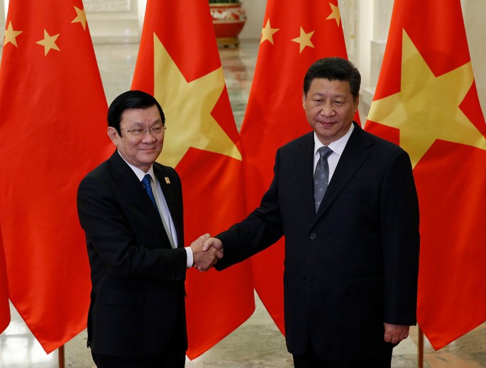 Vietnam's President Truong Tan Sang shakes hands with China's President Xi Jinping on the sidelines of the Asia Pacific Economic Cooperation (APEC) meetings, Nov. 10, 2014 in Beijing, China.