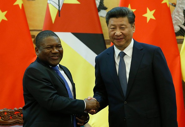 President Xi Jinping shakes hands with Mozambique President Filipe Jacinto Nyusi during a meeting on Wednesday.