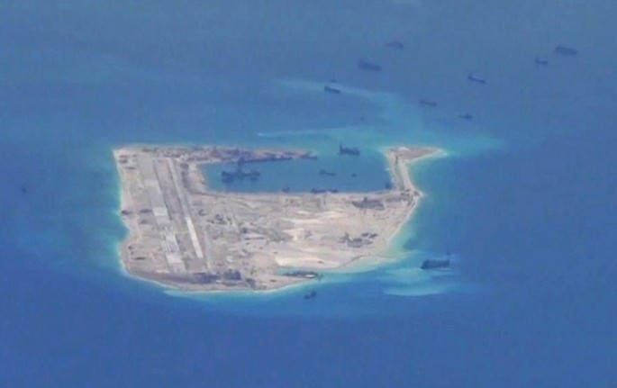 Chinese vessels are seen around Fiery Cross Reef in the disputed Spratly Islands in the South China Sea.