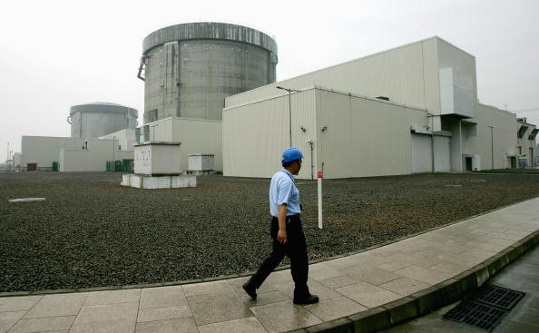 An employee walks outside the Qinshan Nuclear Power Plant in Qinshan of Hangzhou City, Zhejiang Province, China, June 10, 2005.