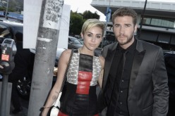 Actress Miley Cyrus and actor Liam Hemsworth attend the premiere of Relativity Media's 'Paranoia' at the DGA Theater on August 8, 2013 in Los Angeles, California.