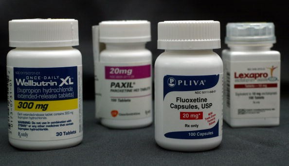 Bottles of antidepressant pills named (L-R) Wellbutrin, Paxil, Fluoxetine and Lexapro are shown March 23, 2004 photographed in Miami, Florida.