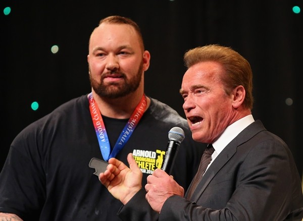 Arnold Schwarzenegger speaks to Hafthor Julius Bjornsson of Iceland after he won the Arnold Classic Professional Strongman competition during the 2016 Arnold Classic on March 19, 2016 in Melbourne, Australia.