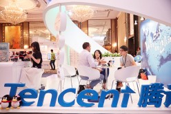  Visitors and exhibitors network at the Tencent booth during the Sportel Asia Conference on March 15, 2016 in Singapore.