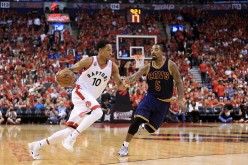 Toronto Raptors' DeMar DeRozan drives against Cleveland Cavaliers' J.R. Smith in the third quarter in Game 6 of the Eastern Conference Finals during the 2016 NBA Playoffs at Air Canada Centre. 