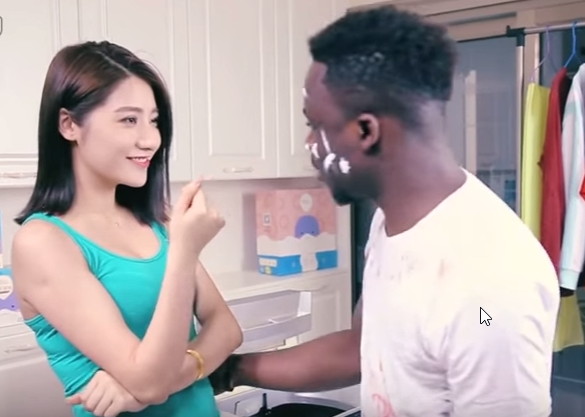 In the ad for the Chinese detergent company,  Qiaobi, a woman places a black man inside the washing machine that later emerged as a light-skinned Asian man.