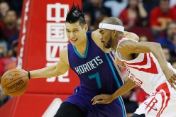 Jeremy Lin drives with the ball against Corey Brewer of the Houston Rockets during their game at Toyota Center last Dec. 21, 2015.