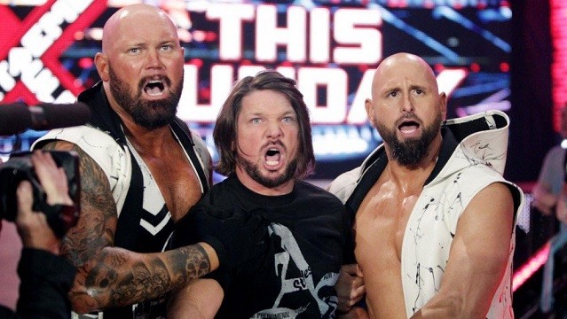 Luke Gallows, A.J. Styles and Karl Anderson, collectively know as The Club, show their reactions to Roman Reigns in an episode of Monday Night Raw.