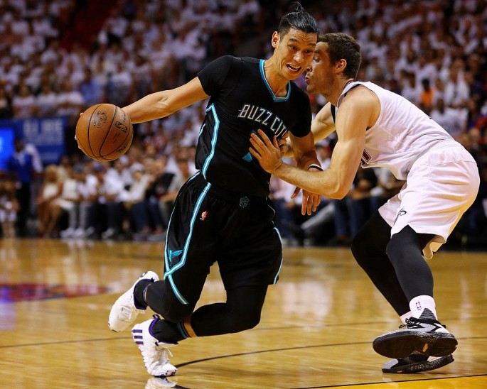 Jeremy Lin #7 of the Charlotte Hornets drives on Goran Dragic #7 of the Miami Heat