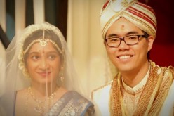 Choosing a citizenship for their children can be tough for interracial couples. (Above) Priya and Yih Feng seal their love in a Ceylonese wedding ceremony held in Malaysia on Dec. 15, 2012.