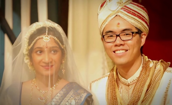 Choosing a citizenship for their children can be tough for interracial couples. (Above) Priya and Yih Feng seal their love in a Ceylonese wedding ceremony held in Malaysia on Dec. 15, 2012.