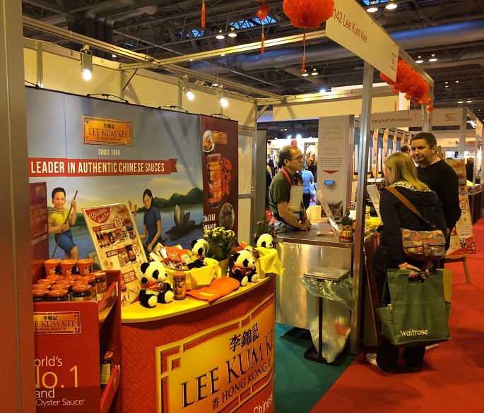 A couple of visitors check out the Lee Kum Kee booth during a 2015 food fair abroad.