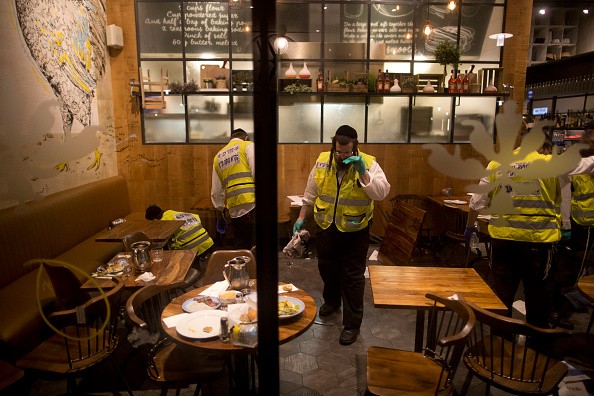 Following the Tel Aviv shooting, members of an Israeli ZAKA - Identification, Extraction and Rescue team work at the scene of a shooting outside Max Brenner restaurant in Sarona Market on June 8, 2016 in Tel Aviv, Israel. 