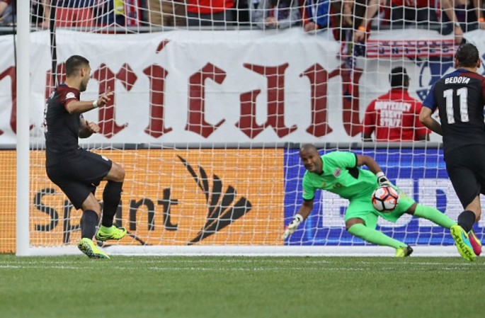 USA striker Clint Dempsey (L) scores the team's opening goal against Costa Rica's Patrick Pemberton.