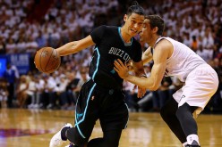 Jeremy Lin #7 of the Charlotte Hornets drives on Goran Dragic #7 of the Miami Heat