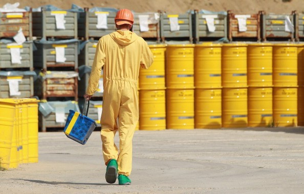  A worker walks by yellow barrels containing potentially radioactive material at the former Rheinsberg nuclear power plant 