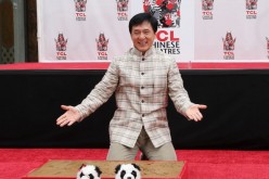 Actor Jackie Chan poses during the Jackie Chan Hand and Foot Print Ceremony at the TCL Chinese Theatre on June 6, 2013 in Hollywood, California.