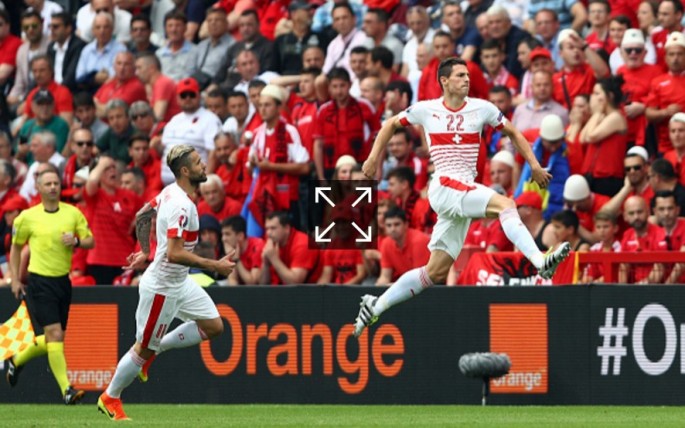 Switzerland defender Fabian Schar (R) celebrates his goal against Albania with teammate Valon Behrami.