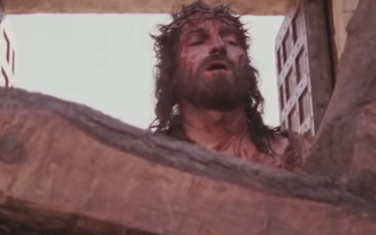 In a scene in "Passion of the Christ," Jesus Christ is about to carry the cross.