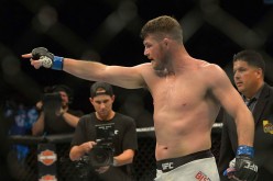 Michael Bisping points to opponent Luke Rockhold after defeating him in their Middleweight Title Bout at UFC 199 at The Forum on June 4, 2016 in Inglewood, California.