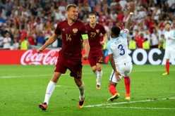 Russia defender Vasili Berezutski (L) scores the equalizer against England.
