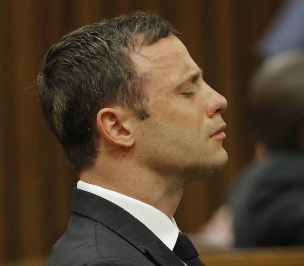 Oscar Pistorius reacts at the Pretoria High Court on September 11, 2014, in Pretoria, South Africa after Judge Thokosile Masipa has ruled out murder charges.