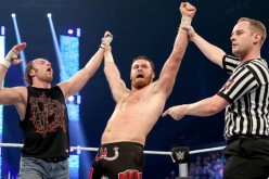 Sami Zayn and Dean Ambrose celebrate their win over Alberto Del Rio and Kevin Owens in an episode of SmackDown.
