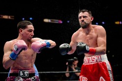 Robert Guerrero (R) reacts after getting hit on the head by Danny Garcia during the WBC championship welterweight bout at Staples Center January 23, 2016 in Los Angeles, California.