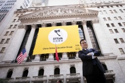 51 Talk founder and CEO Huang Jiajia stands outside the New York Stock Exchange in Lower Manhattan, New York City, on June 10. His language training company went public on June this year. 