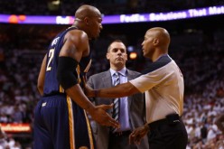 Power forward David West (L) and head coach Frank Vogel talking to a referee during their time together with the Indiana Pacers.