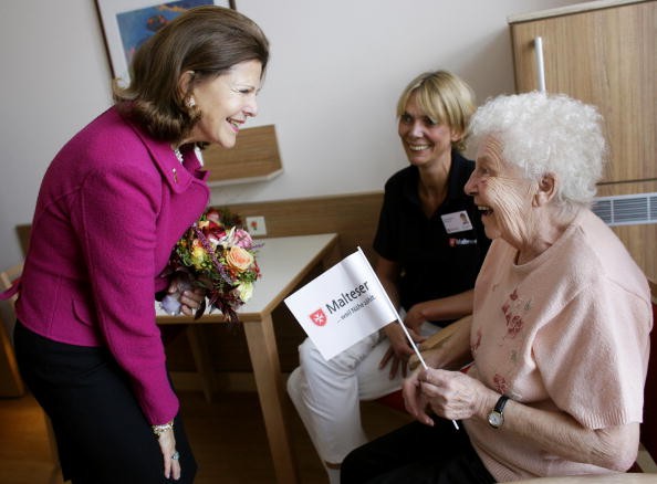 Queen Silvia of Sweden talks to inpatient Margarete Weier, 79, during the opening of the first German section in a hospital for dementia patients  on October 17, 2009 in Cologne, Germany. 
